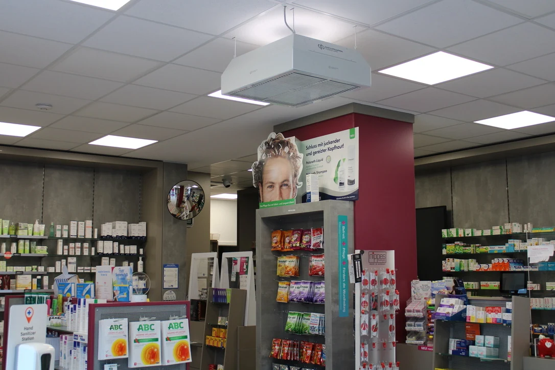 Rectangular dp ceiling air purifier above pharmacy shelves