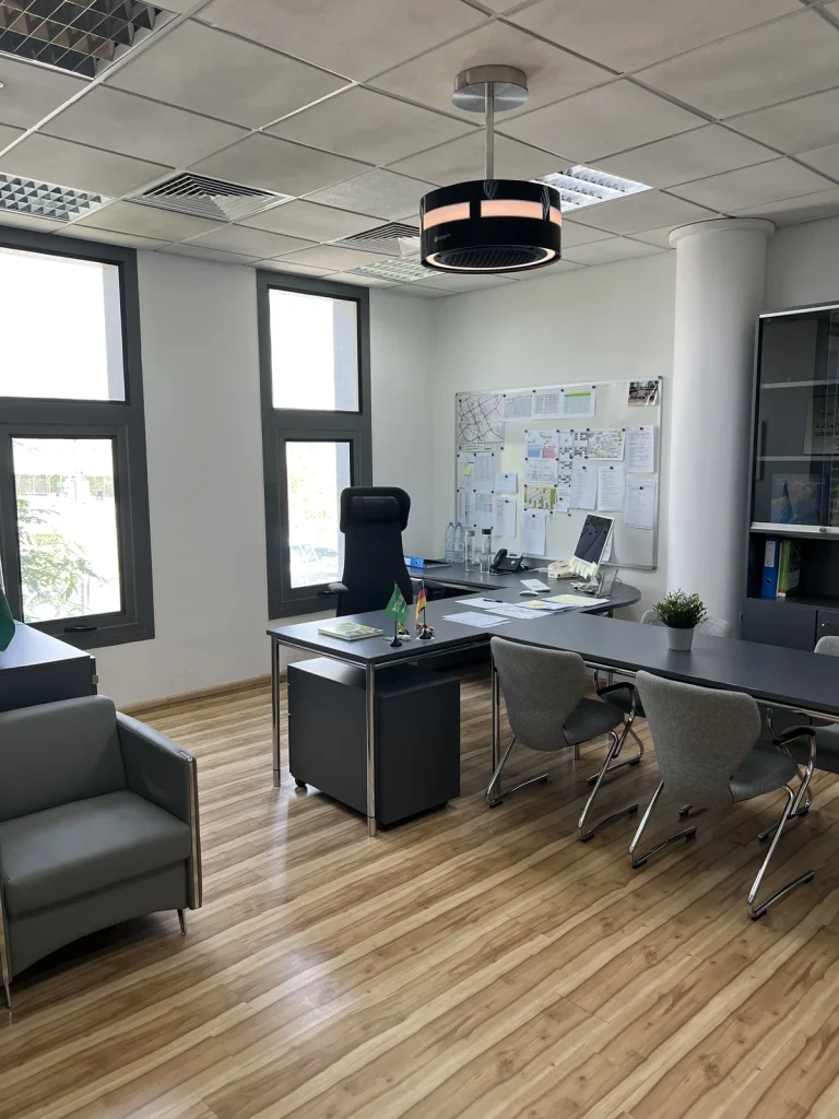 Black dp air purifier above a furnished office
