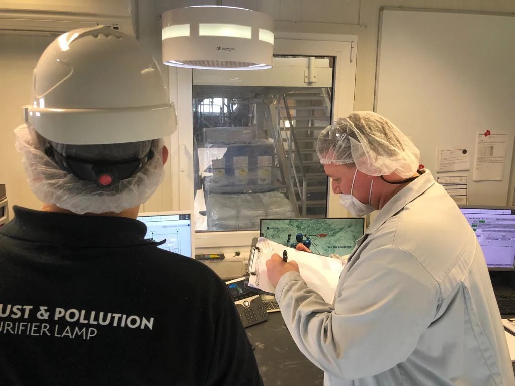 Technicians at a dp installation in a control room