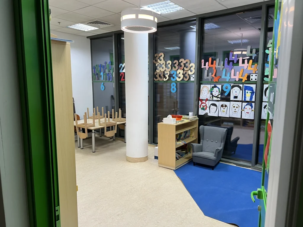 Round dp air purifier installed in a classroom