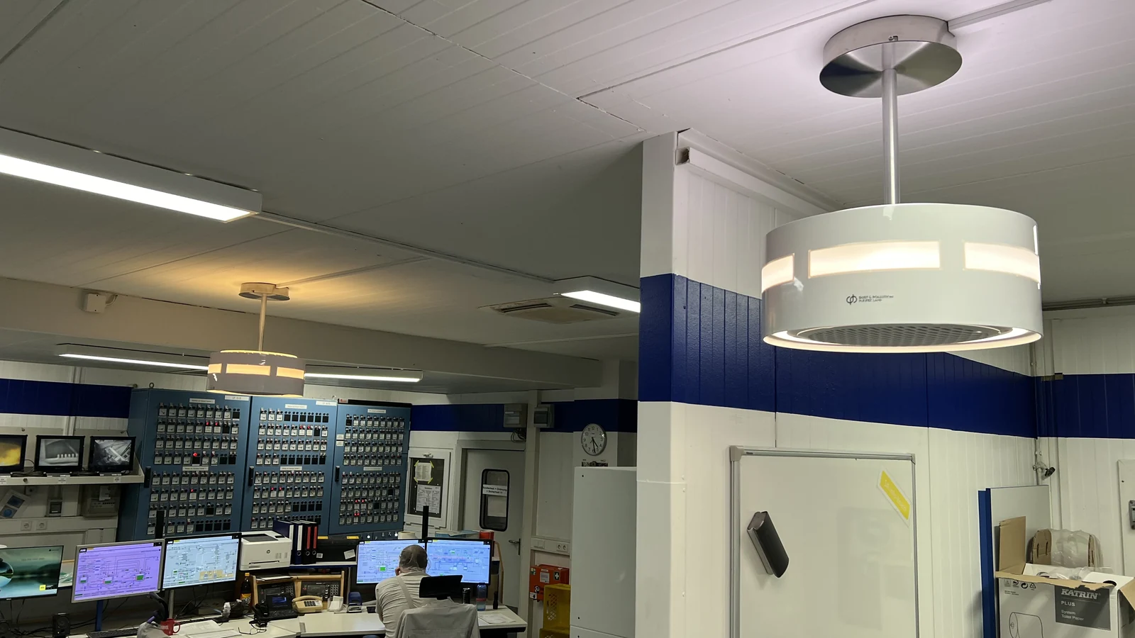 Two dp ceiling air purifiers in an industrial control room